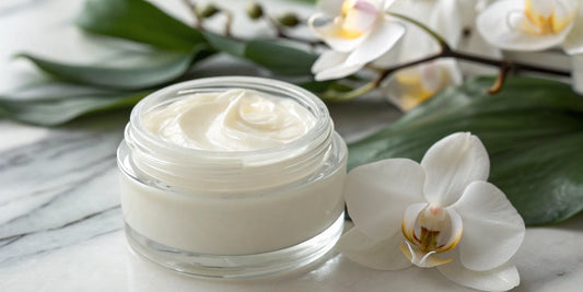 Best nourishing hair treatment cream in a glass jar with orchid flowers.