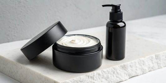 Multi-purpose hair cream for styling in a black jar and matching pump bottle.