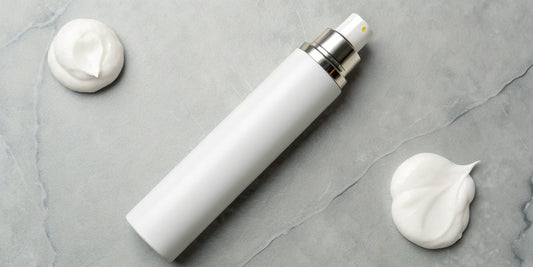 Hair mousse for defining curls shown in a bottle and as a creamy foam.